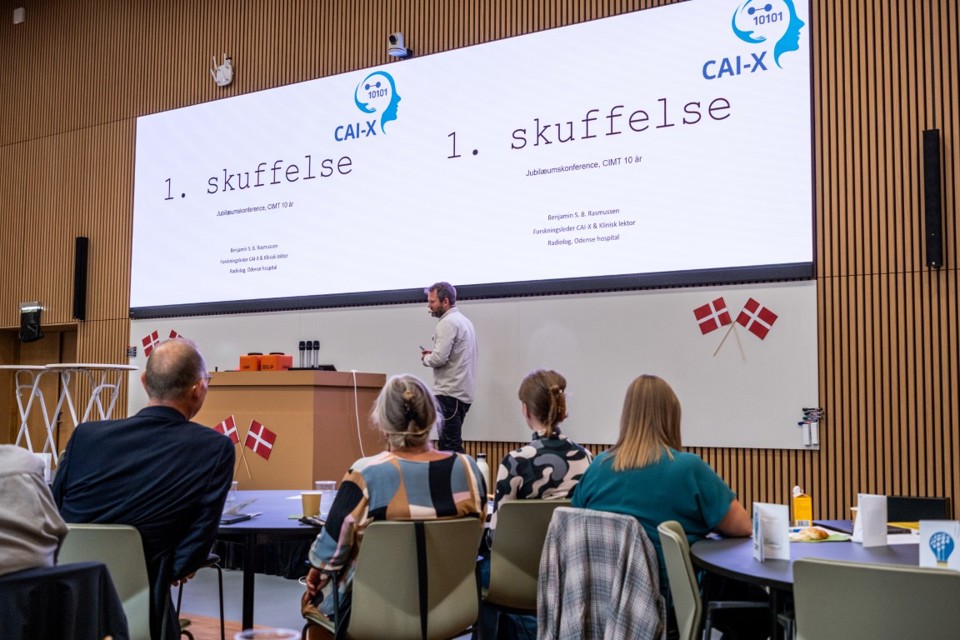 A man on stage discussing disappointments